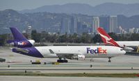 N523FE @ KLAX - Taxiing at LAX - by Todd Royer