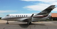 N437JD @ KAXN - Hawker Beechcraft Hawker 900XP at the fuel pump. - by Kreg Anderson