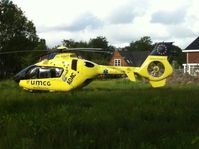 PH-MMT - The pilot in command of the Lifeliner 4 managed to land his beast in the middle of a neighbourhood in Peize. At this way he could show his skills to all the bystanders.
