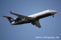 N465AW @ KSRQ - US Air Flight 3633 operated by Air Wisconsin (N465AW) arrives at Sarasota-Bradenton International Airport following a flight from Reagan National Airport - by Donten Photography