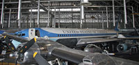 62-6000 @ DWF - Framed by the wing of C-54 Sacred Cow, the first presidential jetliner shows off her majestic lines. - by Daniel L. Berek