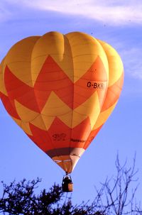 G-BKRI - Summer 1988. Cameron Balloon G-BKRI shown just before landing in farm field behind Barnett Close, Wonersh, in middle of Surrey Hills, UK. - by Alex Morris