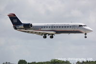 N433AW @ KSRQ - US Air Flight 3633 operated by Air Wisconsin (N453AW) arrives at Sarasota-Bradenton International Airport following a flight from Reagan National Airport - by Donten Photography