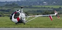 G-WHRL @ EGFP - Resident Schweizer 269C Parked up by the Tower.