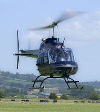 G-TFHW @ EGFP - Bell 206B operated by Fly Heli Wales Ltd ready to set down at Pembrey.