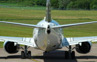 LN-DYK @ EGPH - A nice angle. Turning onto runway 06 for departure to Oslo.