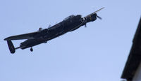 PA474 - BoBMF Lancaster B1 flying past our house whilst displaying at Wales National Airshow Swansea, Flight Crew for the day were, Capt: F/L Tim (Twigs) Dunlop / Co-Pilot: Fl Lt Loz Rushmere / Nav:Sqn Ldr Russ Russell / Air Eng: Flt Sgt Archie Moffatt. - by Derek Flewin