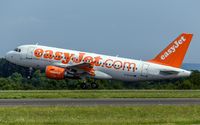 G-EZAO @ ELLX - departure via RW06 - by Friedrich Becker