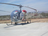 N73943 - Sitting outside with blades tied down - by helicopter206