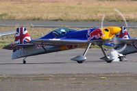 D-EYXA @ EGFH - One of the visiting Red Bull Matadors aerobatics duo. Arriving for the two day Wales National Air Show, Swansea Bay, UK. - by Roger Winser