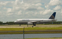N409UA @ RSW - Taking Off RWY 6