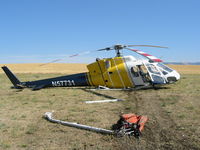 N57731 - On 8/13/ 03 I was one of the two witnesses to the autorotation to a hard landing on the east edge of Lake Mann, two miles north northwest of Webb, Idaho. The pilot walked away slowly with help for about 100 ft. I retain all copy copyrights to this photo. - by Dave Jones