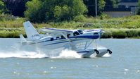 C-FTEL @ CYVR - Private Telus Kodiak taking off on the Fraser River. - by M.L. Jacobs
