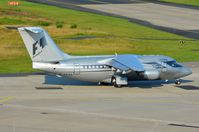 G-OFOA @ EDDK - Formula I BAe146 taxying out to depart to Biggin Hill after German GP at Nurnbergring. - by FerryPNL