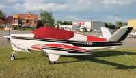 C-FINV @ KAXN - Beech M35 Bonanza in overflow parking. - by Kreg Anderson