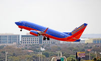 N904WN @ TPA - This 2008 Boeing 737 lifts off runway 19R at Tampa Int'l Airport - by Ron Coates