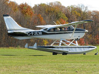 C-FJEM @ CNV6 - This Stationair looked good in black paint as it taxied to the active. The Co-pilot in the right seat was a young kid. He must have been very excited to go flying! This Cessna lives here at Orillia's Lake St. John seaplane base.