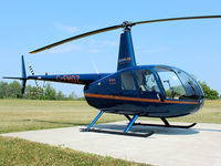 C-FHOZ @ CLA4 - This 2006 Robinson R44 II sits outside the Silverline Helicopters hanger at Holland Landing Airport (CLA4) north of Toronto - by Ron Coates