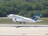 C-GWSN @ KTPA - Lifting off runway 18R at Tampa Int'l Airlines this Boeing 737 of Westjet Airlines heads out over Tampa Bay