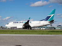 C-GWJE @ CYYZ - This 2007 Westjet Boeing 737-7CT is heading for runway 23 at Toronto Int'l Airport (YYZ)