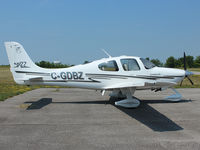 C-GDBZ @ CLA4 - This 2003 Cirrus SR22 sits quietly in the noon day sun at Holland Landing Airport (CLA4) north of Toronto - by Ron Coates