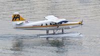 C-FJHA @ CYHC - Harbour Air #318 taxiing for departure from Coal Harbour. - by M.L. Jacobs
