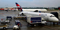 N965DL @ KATL - At the gate. Serviceing aircraft.  ATL - by Ronald Barker