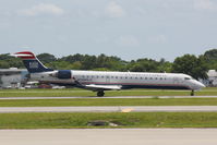 N709PS @ KSRQ - US Airways Flight 4591 operated by PSA (N709PS) arrives at Sarasota-Bradenton International Airport following a flight from Charlotte-Douglas International Airport - by Donten Photography