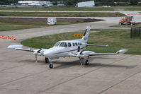 N318AA @ KIOW - Seen from the viewing point above the terminal. - by Glenn E. Chatfield
