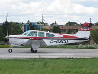 C-GSCU @ CYKZ - This 1992 Beech Bonanza of the Seneca College Flying School waiting to be cleared off runway 33 at Buttonville Airport (CYKZ) - by Ron Coates