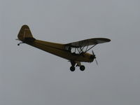 N33112 @ SZP - 1940 Piper J3C-65 CUB, Continental C90 90 Hp upgrade, low level jinking below the overcast - by Doug Robertson