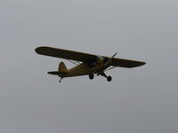 N33112 @ SZP - 1940 Piper J3C-65 CUB, Continental C90 90 Hp upgrade, low level jinking below the overcast - by Doug Robertson