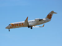 C-GKER @ CYYZ - Landing on rwy 33L at Toronto Int'l Airport this Bombardier CL600 glides along in a cloudless sky - by Ron Coates
