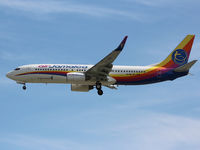 9Y-JMB @ CYYZ - This Caribbean Airlines (Air Jamaca) 2002 Boeing 737 prepares to land on rwy 33L at Toronto Int'l Airport - by Ron Coates