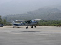 N704UT @ SZP - 1976 Cessna 150M, Continental O-200 100 Hp, takeoff Climb Rwy 22 - by Doug Robertson