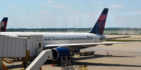 N6712B @ KDTW - Loading baggage at Gate A10 Detroit - by Ronald Barker