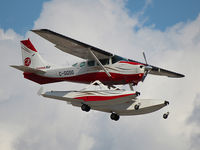 C-GGSG @ YYZ - This 1980 Cessna TU206G is landing on Rwy 23 at Toronto Int'l Airport - by Ron Coates
