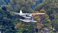 C-GFLT @ CYHC - Tofino Air coming in over Stanley Park to land in Coal Harbour.