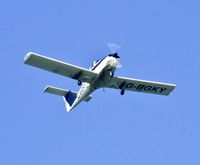 G-BGKY - Piper Tomahawk operated by Cambrian Flying Club at EGFH, overflying the Worms Head, Rhossili area of Gower. - by Derek Flewin