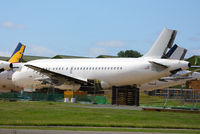 N802FR @ EGDX - ex Frontier Airlines A318 in storage at St Athan - by Chris Hall