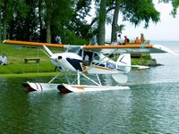 N522DN @ KOSH - AirVenture 2013 Seaplane Base, engine cut and coasting to a perfect docking at the landing stage