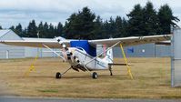C-FTAL @ CYXX - This Canadian Air Cadets Cessna is tied down on the grass parking area.