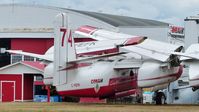 C-FEFK @ CYXX - Conair #74 fire-fighting tanker is out of service but still registered and sits beside the Conair Aviation hangar.