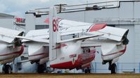 C-FOPY @ CYXX - Conair #69 fire-fighting tanker is out of service but still registered and sits beside the Conair Aviation hangar. - by M.L. Jacobs