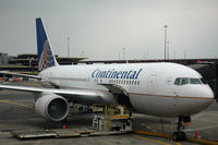 N68159 @ EWR - at the gate, loading luggage & passengers - by Bruce H. Solov