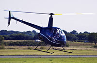 G-MDKD @ EGFH - EGFH based Robinson R22 BETA, newly arrived after a complete refit in California USA, replacing G-LINS, Operated by HeliAir. - by Derek Flewin