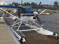C-GYZL @ CTA5 - Strong winds made this Skywagon sound like it wanted to break free from its dock on Lac Lemoine at the Hydrobase Piche Dubuisson Seaplane near Val-d'Or, Quebec. I liked its see-through doors & the Viking emblem on its tail. - by Chris Coates