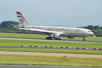 A6-EYM @ EGCC - Etihad Airbus A330-243 A6-EYM landed at Manchester Airport. - by David Burrell