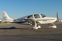 N678DF @ CYKZ - This nice Cirrus was resting on the Terminal ramp as the sun was sinking low. - by Chris Coates
