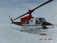C-FMLT @ CYUS - C-FMLT in Sheperd Bay (CYUS), Nunavut Canada, April 2013.  Note the cold-weather tarp (company based in Goose Bay), electrical plugs for Tannis Heater, and automotive space heaters. Flying operations cease when ambient air temperature reaches -40C / -40F. - by T.B. Orlowski, BH12 Aircraft Captain